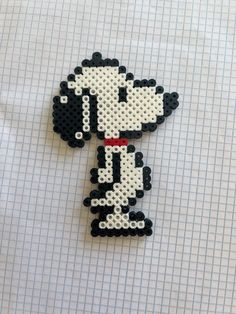 a piece of art made to look like a cartoon character with black and white dots on it