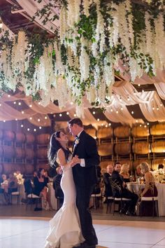 a bride and groom sharing their first dance