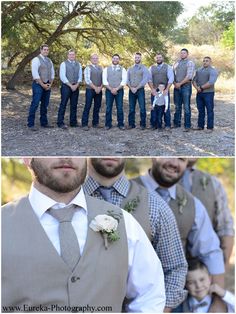 a group of men standing next to each other in front of trees and dirt ground