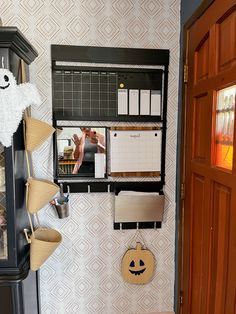 a shelf with many items on it in a room next to a door and wall