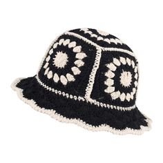 a black and white crocheted hat with flowers on it's brim