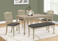 a dining table with four chairs and a bench