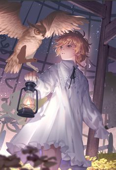 a girl holding an owl on her arm next to a lantern