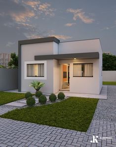 a small white house sitting on top of a lush green field