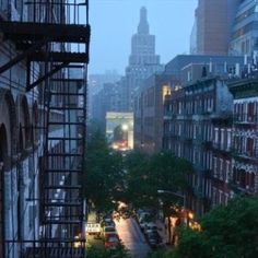 a city street filled with lots of tall buildings