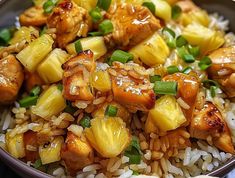 chicken and pineapple stir fry with rice in a bowl