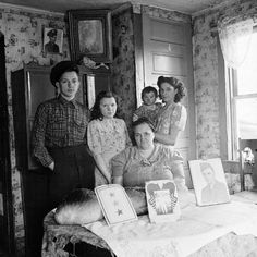 an old black and white photo of a family