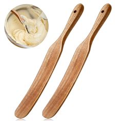 two wooden spoons with cream on them