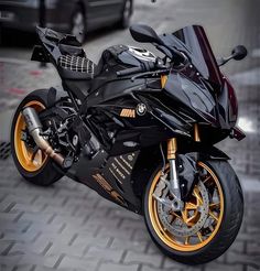 a black and gold motorcycle parked on the street