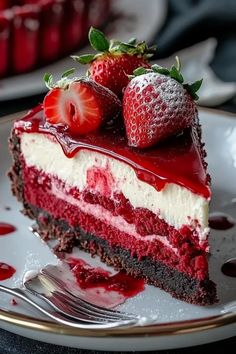 a piece of cake with strawberries on top is sitting on a plate next to a fork