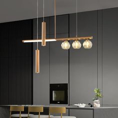 a dining room table with chairs and lights hanging from it's ceiling over it