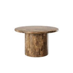 a round wooden table sitting on top of a white wall