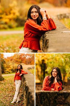 a beautiful woman posing on a stone wall in the fall