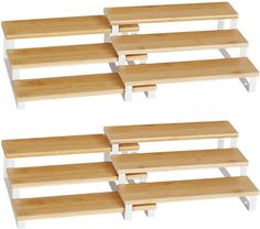 three wooden shelves sitting next to each other