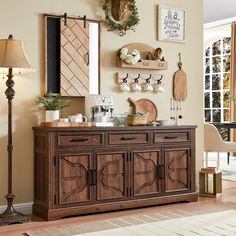 a wooden buffet table sitting in a living room