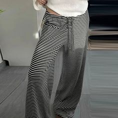 SPECIFICATIONSBrand Name: FlytonnStyle: CasualAge: JUNIOROrigin: Mainland ChinaSeason: SummerWaist Type: highDecoration: noneElasticity: Slight StrechFabric Type: BroadclothHign-concerned Chemical: NonePattern Type: StripedPant Style: Wide leg pantsMaterial: POLYESTERMaterial: SPANDEXFit Type: regularLength: full lengthCraft of Weaving: TATRelease Date: Summer 2024Place Of Origin: China (mainland)Closure Type: DrawstringGender: WOMENModel Number: Women PantsFront Style: Flat Retro Chic Fashion, Low Waisted Pants, Streetwear Trousers, Straight Sweatpants, Sweatpants Women, Striped Pant, Baggy Sweatpants, Black Wide Leg Trousers, Striped Wide Leg Pants