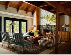 a living room filled with furniture and a fire place