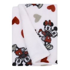 the mickey mouse blanket has hearts on it and is white with red trimmings