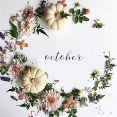 the word october surrounded by flowers and pumpkins on a white background with greenery