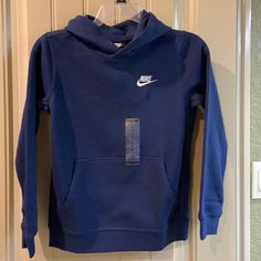 Boys Pullover Sweatshirt By Nike Brand, Size Medium. See Measurements For Specifics On Size! Pullover Hood, Brand Name In White Embroidery Hand Warming Pocket Long Banded Sleeves Ribbed Band Around Waistband Navy Blue Nike Sticker Body-80% Cotton/20% Polyester Hood Lining - 100% Cotton Rib - 97% Cotton/3% Spandex Machine Washable! Nwt! Grey Nike Jacket, Nike Azul, Navy Blue Nike, Bday List, Tech Fleece Hoodie, Pink Crewneck Sweatshirt, Embroidery Hand, Nike Zip Up, Camo Hoodie