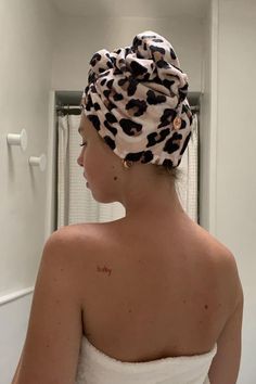 a woman with a towel wrapped around her head