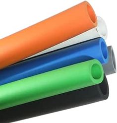 four different colored plastic tubes are stacked on top of each other