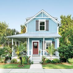 a blue house with white trim and red door