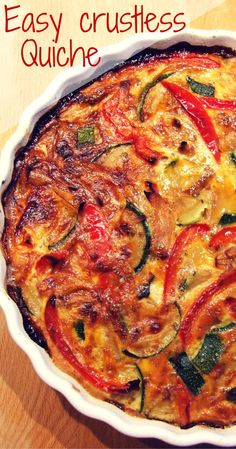 an easy crustless quiche with tomatoes and zucchini in a white dish