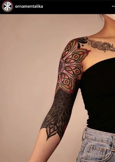 a woman with a tattoo on her arm