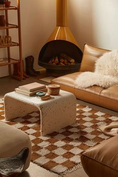 a living room filled with furniture and a fire place