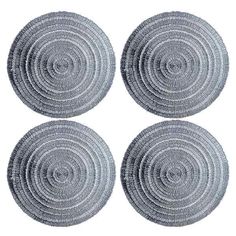 four round woven placemats on white background