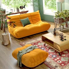 a living room filled with furniture and plants