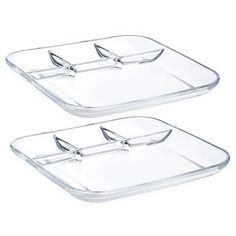 two clear glass trays with handles