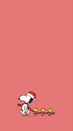 snoopy christmas wallpaper with santa hat and sunflowers on the ground in front of him