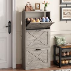 a wooden shoe cabinet sitting next to a door