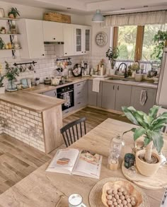 a kitchen filled with lots of counter top space next to a dining room table and chairs