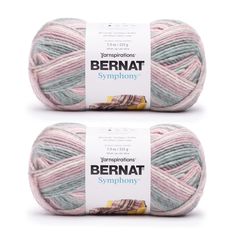 two skeins of yarn with the words bernat in white and pink on them