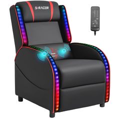 a black chair with red and blue lights on it next to a tv remote control