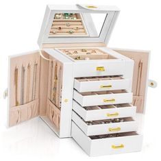 an open jewelry box with five drawers