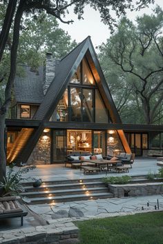 a house that is surrounded by trees and grass