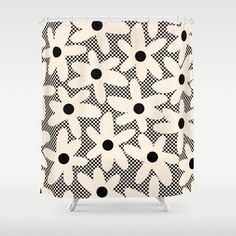 a black and white shower curtain with polka dots