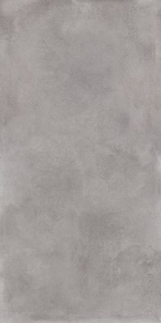 an image of a gray concrete wall textured with light grey paint on the walls