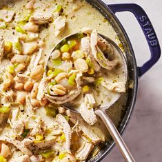 a large pot filled with chicken and beans