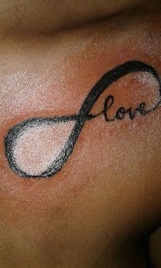 a woman's breast with the word love drawn on it