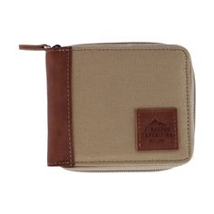 Featuring a zip-around style, this canvas and leather wallet is great for everyday use. Inside, you'll discover a snap coin compartment, 3 card slots, two utility pockets, and a full-length bill slot. The exterior features a square Buxton expedition logo patch and is equipped with RFID protection, ensuring safety during all outings. Made of Leather Brown Travel Wallet With Zipper Closure, Beige Leather Wallet With Zipper Closure, Casual Travel Wallet With Zipper Closure, Casual Brown Wallet With Zipper Closure, Functional Brown Travel Wallet, Casual Beige Travel Wallet, Functional Wallets With Coin Pocket For Travel, Functional Travel Wallets With Coin Pocket, Beige Travel Wallets With Zipper Closure