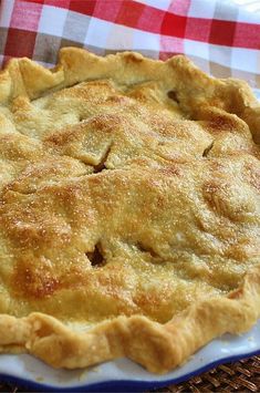 a pie sitting on top of a blue and white plate