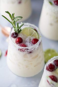 cranberry and lime margaritas are garnished with fresh herbs for an easy holiday appetizer