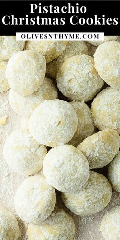 a pile of powdered sugar doughnuts sitting on top of a table