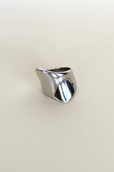 Put the spotlight on your unique style with this Exaggerated Glossy Signet Ring! You'll turn heads when you strut your stuff with this edgy and eye-catching statement piece. Featuring a glossy, oversized silver setting, you'll feel like an A-lister every time you slip it on! *wink* All of our jewelry comes with a free jewelry pouch and cloth to keep your pretties safe and clean. Details Color: Silver | Comes in GoldMaterial: Stainless SteelSizes: 6, 7, 8 Care Guide Store in a dry, cool place awa Modern Silver Rings For Party, Minimalist Silver Rings For Party, Sleek Silver Jewelry For Party, Modern Metallic Jewelry, Chic Silver Rings For Party, Chic Silver Party Rings, Edgy Silver Metal Rings, Unique Polished Sterling Silver Signet Ring, Luxury Sterling Silver Statement Signet Ring