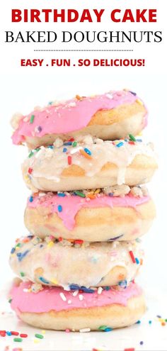 a stack of doughnuts with pink frosting and sprinkles